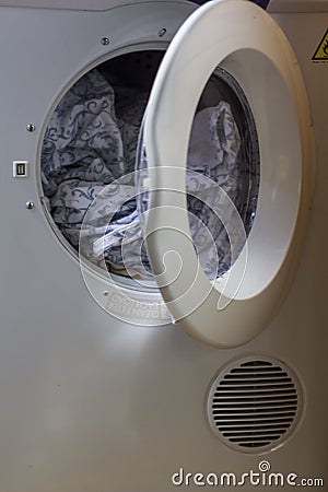 Washing machine with dirty clothes Stock Photo