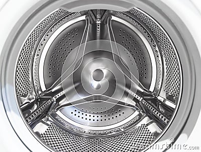 Washing machine drum close up. Washing machine background. Inside the washing machine. Metal washing machine drum. Perforated Stock Photo