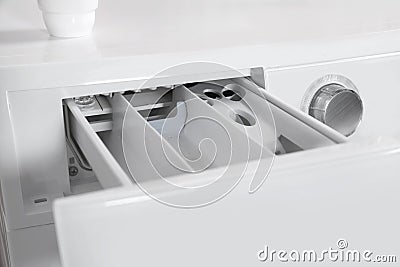 Washing machine with open detergent drawer, closeup. Stock Photo