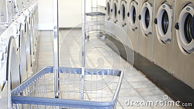 Washing machines, public coin laundry, USA. Self-service laundromat, laundrette. Stock Photo
