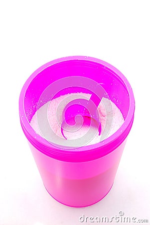 Washing powder in pink container Stock Photo