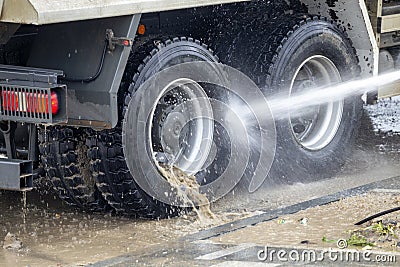 Washing truck wheels off dirt Stock Photo