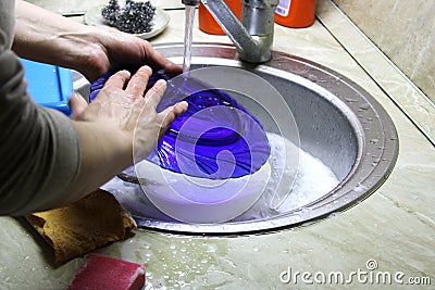 washing water dishes sink work Stock Photo