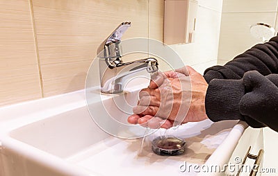 Washing your hands at the sink removes bacteria and viruses from hands Stock Photo