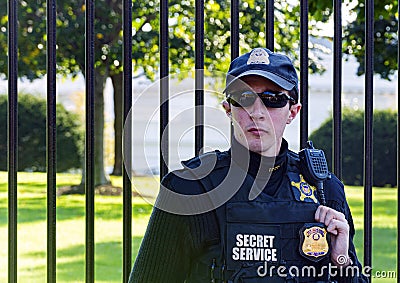 Young officer wearing sunglasses and the uniform of the American Secret Service guarding the White House in Washington D.C Editorial Stock Photo