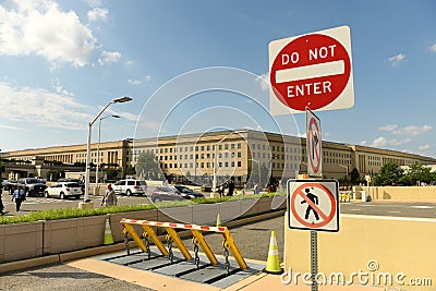Washington, DC - June 01, 2018: Safety barriers and stop sign in Editorial Stock Photo