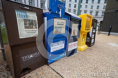 Washington DC - May 9, 2019: Newspaper vending machines along the sidewalks of downtown District of Columbia, for periodicals such Editorial Stock Photo