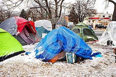 Washington, DC, USA - Feb. 14, 2020: homeless tents covered in ice in winter in the middle of the city Editorial Stock Photo