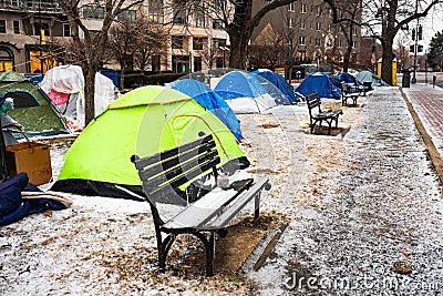 Washington, DC, USA - Feb. 14, 2020: homeless tents covered in ice in winter in the middle of the city Editorial Stock Photo