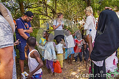 Wasini island, Kenya, AFRICA - February 26, 2020: Little local children begging for sweets from tourists on Wasini Editorial Stock Photo
