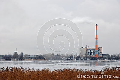 Waste incinerator plant with smoking smokestack. The problem of environmental pollution by factories. Stock Photo