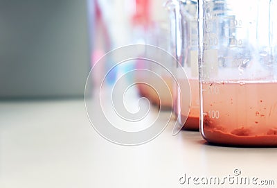 Waste water sample in beakers coagulation and flocculation method with Ferric chlorine and using Jar test for forming precipitate. Stock Photo