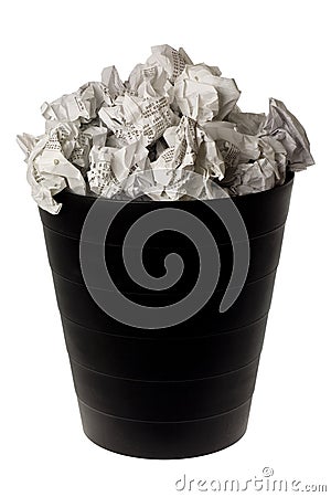 Wastepaper basket full of crumpled paper Stock Photo