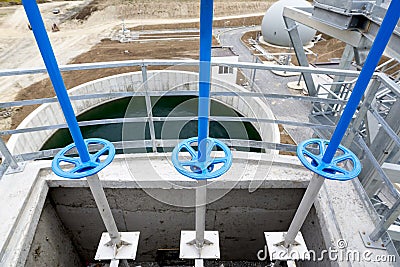 Wastewater treatment facility valves pipes Stock Photo