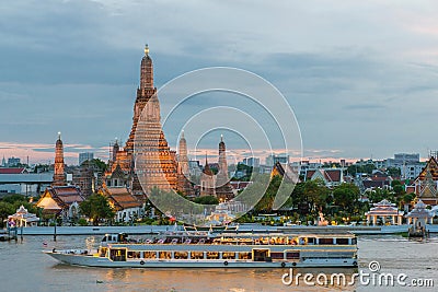 Wat Arun and cruise ship in night ,Bangkok city ,Thailand Stock Photo