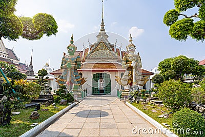 Wat Arun Ratchawararam of giants front of the church and nobody in front Entrance door buddhist temple of tourists and landmark Stock Photo