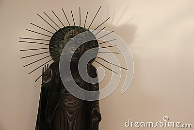 One Standing Metal Buddha Blessing Stock Photo