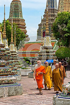 23/06/17 Wat Pho Temple, Bangkok, Thailand. Monks walk among the Editorial Stock Photo