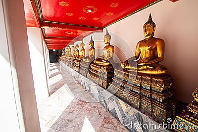 Wat Pho or Wat Phra Chetuphon buddhist temple . golden buddha statue sitting . line pattern of old historic architecture . famous Stock Photo