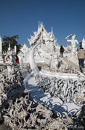 Wat Rong Khun entrance bridge and `the cycle of rebirth` Editorial Stock Photo