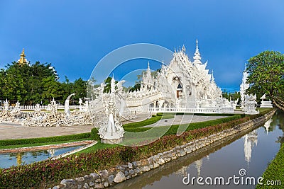 Wat Rong Khun The White Abstract Temple and pond with fish, in Chiang Rai, Thailand Stock Photo