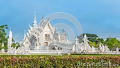 Wat Rong Khun The White Abstract Temple and pond with fish, in Chiang Rai, Thailand. Stock Photo