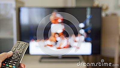 Watch boxing match on tv Stock Photo