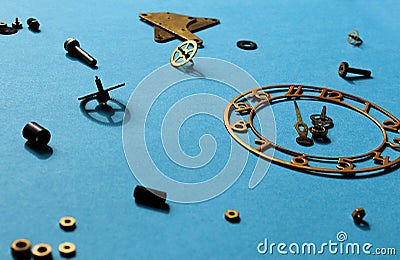 Details of old watches are scattered on the table Stock Photo