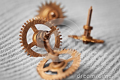 Watch gears on sand - abstract still life Stock Photo