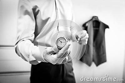 Watch groom hand Stock Photo