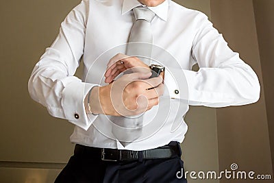 Watch groom hand Stock Photo