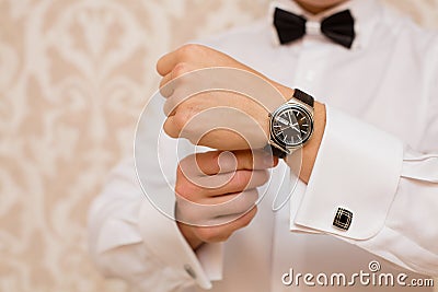 Watch on the groom's hand Stock Photo