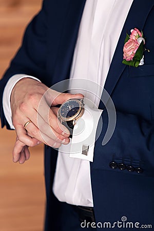 Watch on the groom's hand Stock Photo