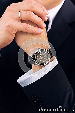 Watch on the groom's hand Stock Photo