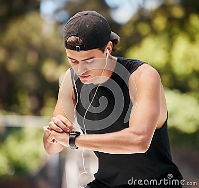 Watch, man and check fitness with music for cardio exercise training in nature park. Audio motivation lifestyle, sports Stock Photo