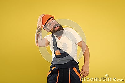 Watch out. repairman fix anything. serviceman in uniform. mature and experienced builder in hard hat. expert in Stock Photo