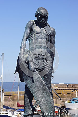 Watchet, UK: bronze statue of the Ancient Mariner at Watchet Harbour Editorial Stock Photo