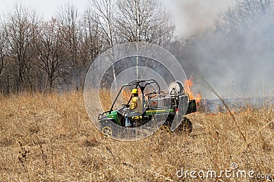 Watching the flames from All Terrain Vehicle Editorial Stock Photo
