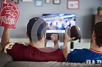 Watching football game Stock Photo