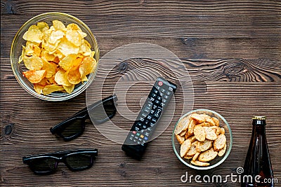 Watching movies set with chips on wooden background top view mock up Stock Photo