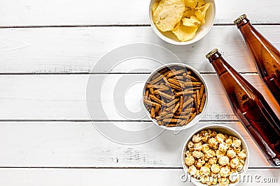 Watching TV with chips, beer and pop corn on white background top view mock up Stock Photo