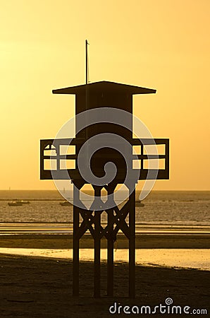 Watchtower on a beach at sunset Stock Photo
