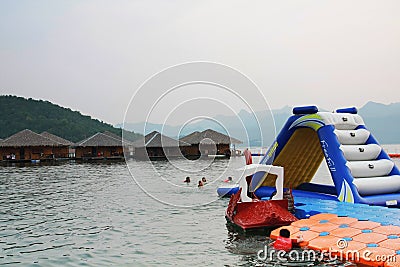 Water activity at the floating house residence in Kanchanaburi, Thailand Editorial Stock Photo