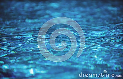 Water background. Blue water, ripples and highlights. Texture of water surface and tiled bottom. Stock Photo
