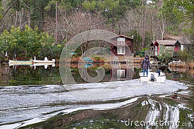 Water boat view La Marina de Talaris exceptional natural setting in the heart of the pine forest in Lacanau lake village France Editorial Stock Photo