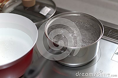 water boiling on an infared range top Stock Photo