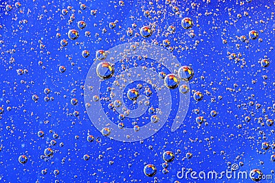 Water bubbles on blue background. Scientific image of cell membrane. Macro up of liquid substances. Abstract molecule atom sctruct Stock Photo