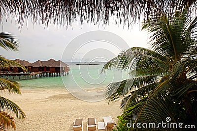 Water bungalows, ocean and sky in Maldives Stock Photo