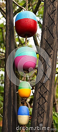 Water buoys strung on rope Stock Photo