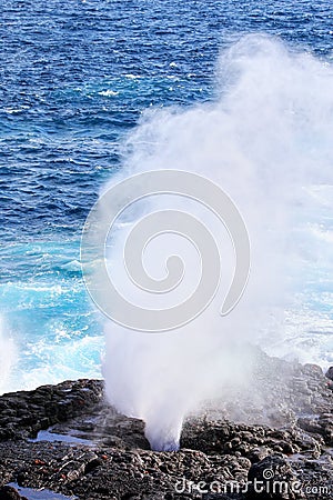 Water bursts through blowhole on Espanola Island, Galapagos National park, Ecuador Stock Photo